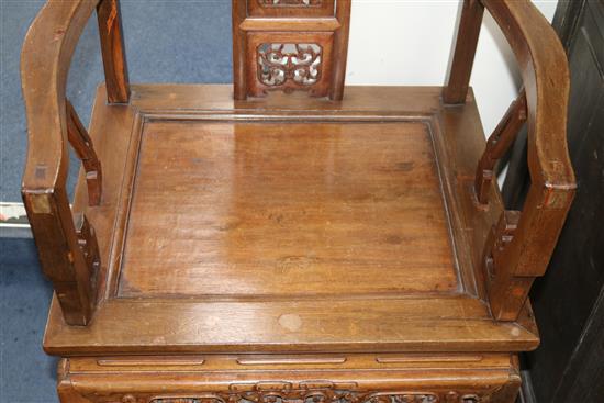 A pair of Chinese carved hardwood elbow chairs